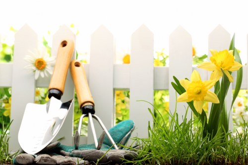 Lawn care technician working in Yeading gardens