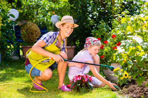 Operative wearing PPE using garden machinery safely